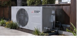 Clean heat pump condenser installation beside a Los Angeles home